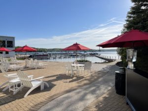 Private Back Patio at Hotel Walloon overlooking Walloon Lake with guest only seating
